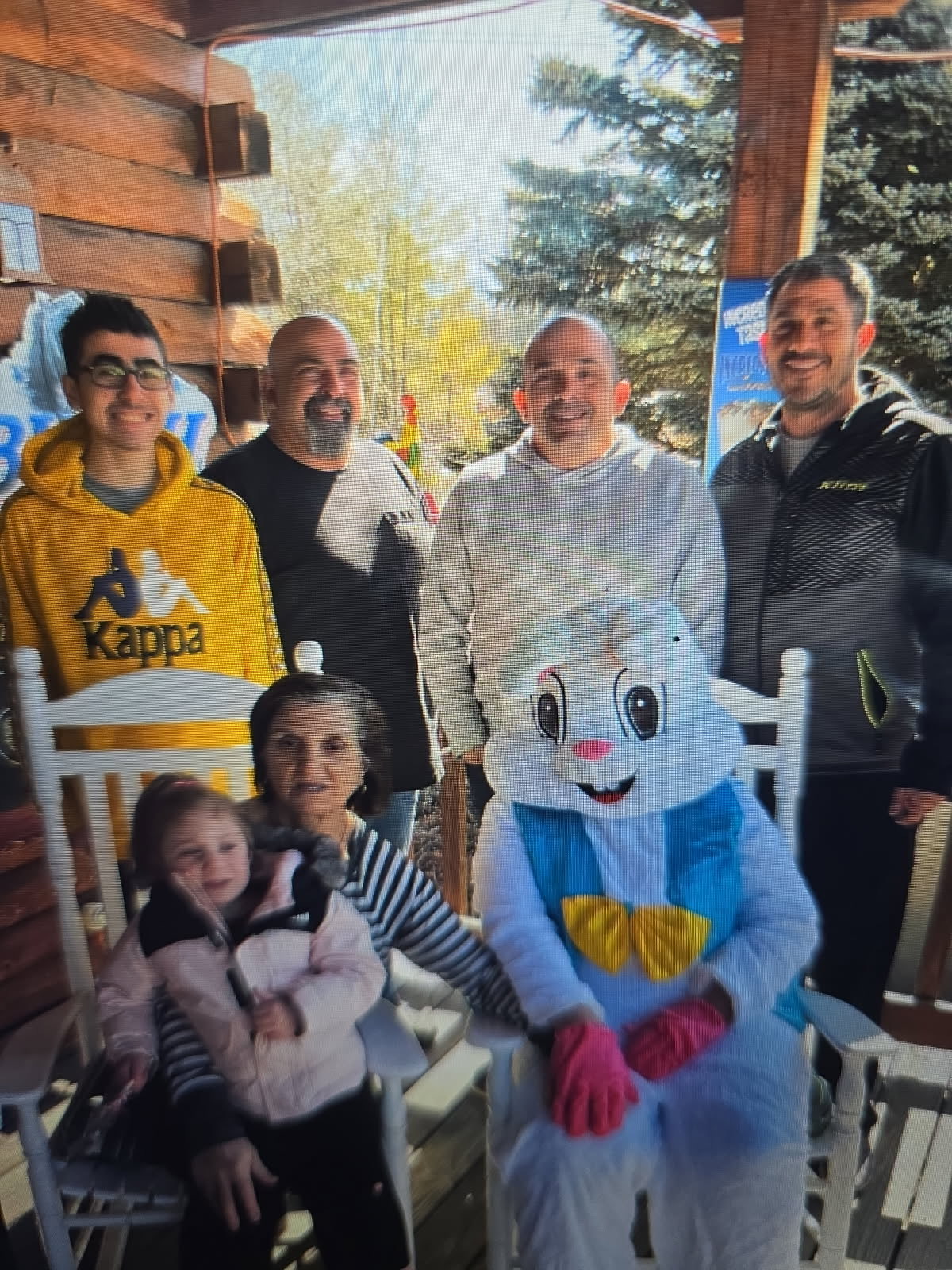 The Nicolazzo family with the Easter Bunny on the porch